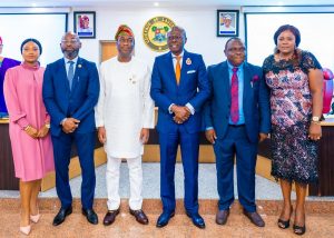 Governor of Lagos State, Mr. Babajide Sanwo-Olu (third right); his Deputy, Dr. Obafemi Hamzat (third left); new Special Adviser on Infrastructure, Mr. Olufemi Daramola (second left); his wife, Mrs. Daramola (left); new Commissioner for Energy & Mineral Resources, Mr. Biodun Ogunleye (second right) and his wife